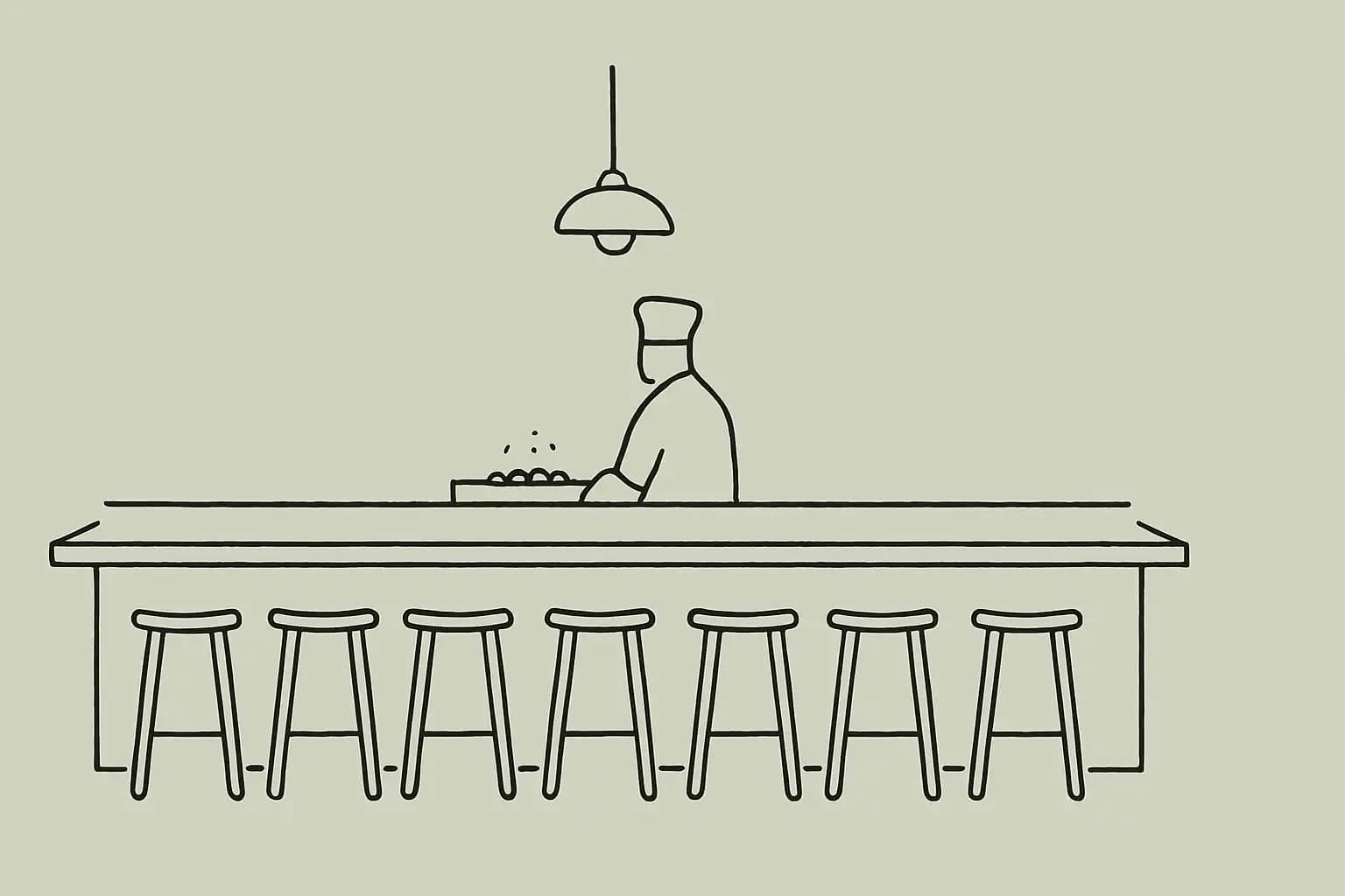 Chef's counter at an intimate eight-seat restaurant in Calgary, charcoal grill ready for service